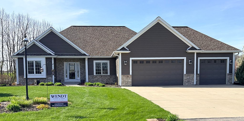 Beautiful home exterior with new windows and doors installed